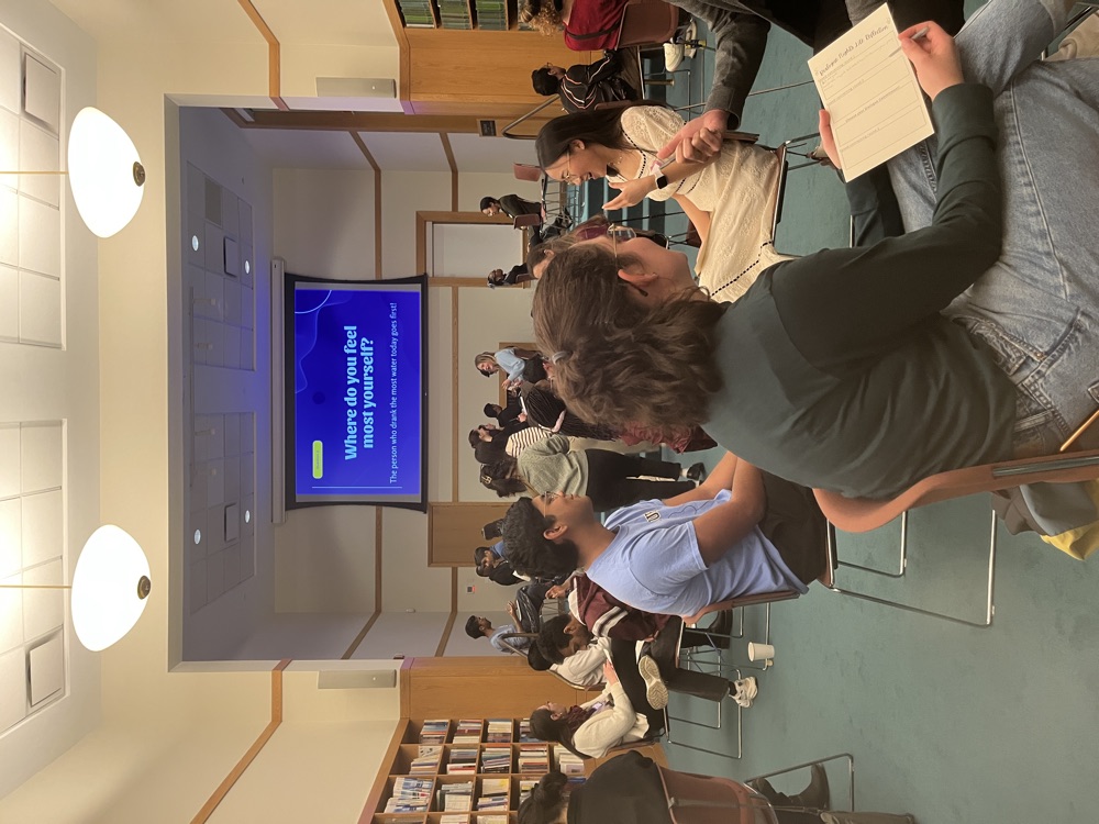 People talking in pairs during a Dialogue Night at the Ikeda Center